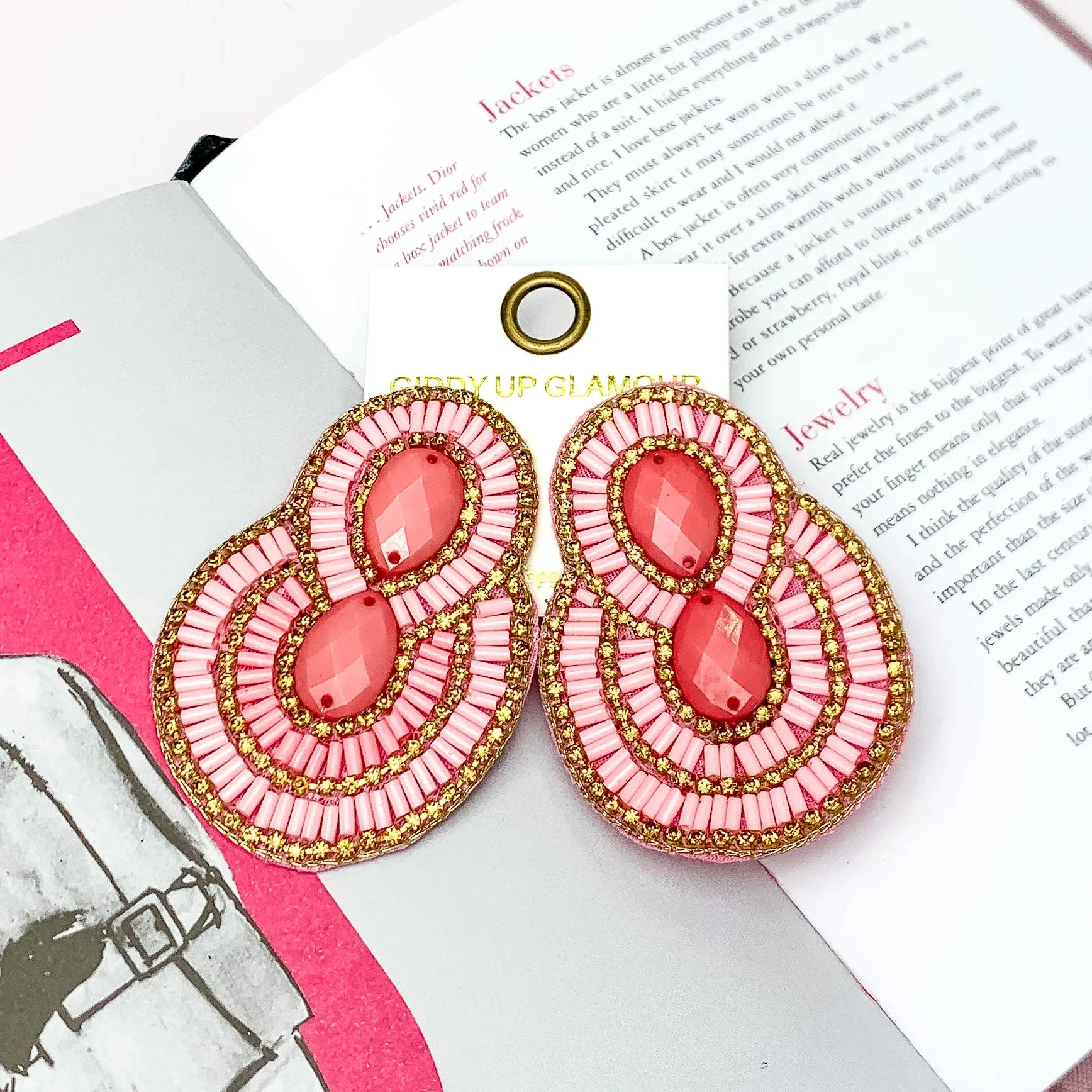 Dazzling Oval Earrings Outlined in Gold Tone Crystals with Beads in Light Pink